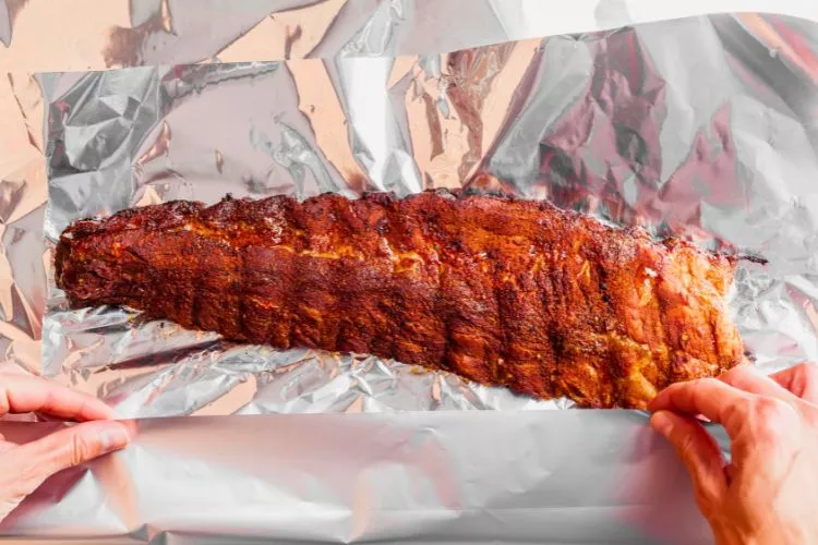 What is the best way to pre cook ribs before grilling